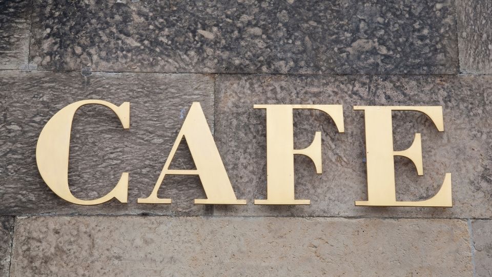 5 Sign Products to Revamp Your Interior for Any Budget 1 (An acrylic wall sign can be seen for a cafe in the image)