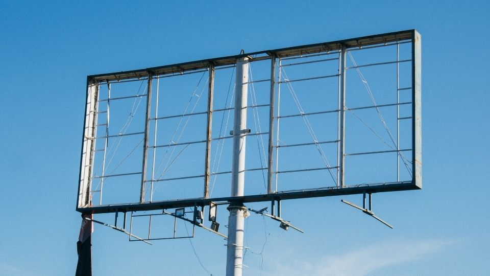 Why Professional Hoarding Boards Printing Matters for Brand Visibility 1 (In the Image a hoarding board can be see under design and turning it functional)