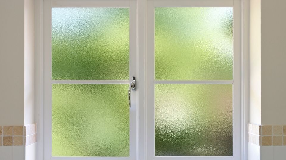 The Comprehensive Guide to Window Frosting: Enhancing Privacy, Style, and Functionality 1 (In the image a room can be seen having a frosted window)