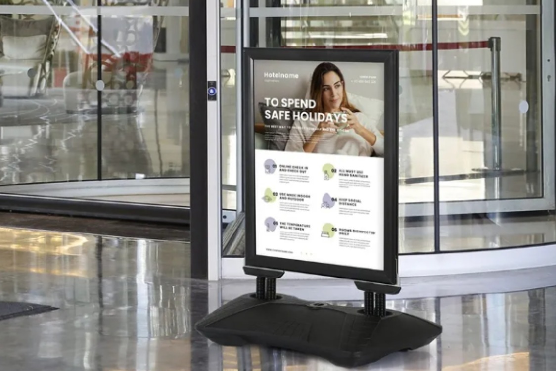 Pros and Cons of Having Weatherproof Outdoor Signs 1 A large informational sign on a stand positioned in a lobby area, providing guidance to visitors. weatherproof outdoor signs