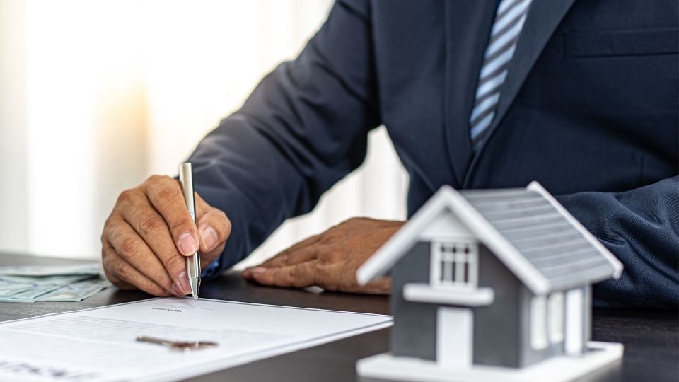 (In the image a solicitor can be seen working on a local property dispute case)