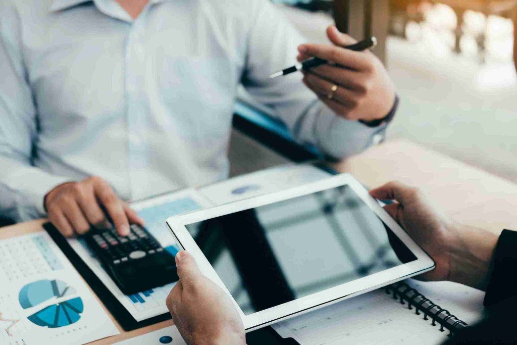 In the image it can be seen a person is handling his tax and VAT matters in a digital way.