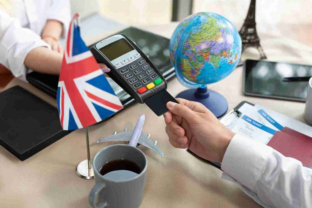 A man is paying collecting VAT tax from a business man.