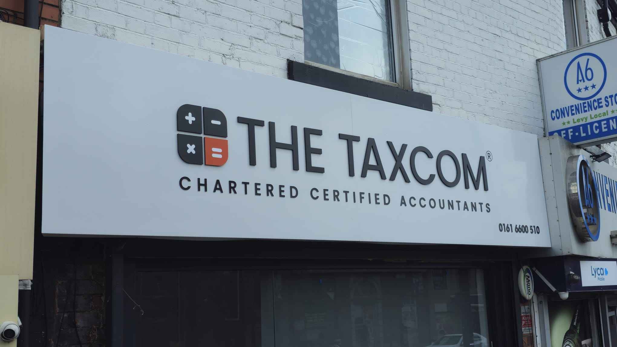 Outdoor business signs installed on a commercial building by Manchester Signs Centre