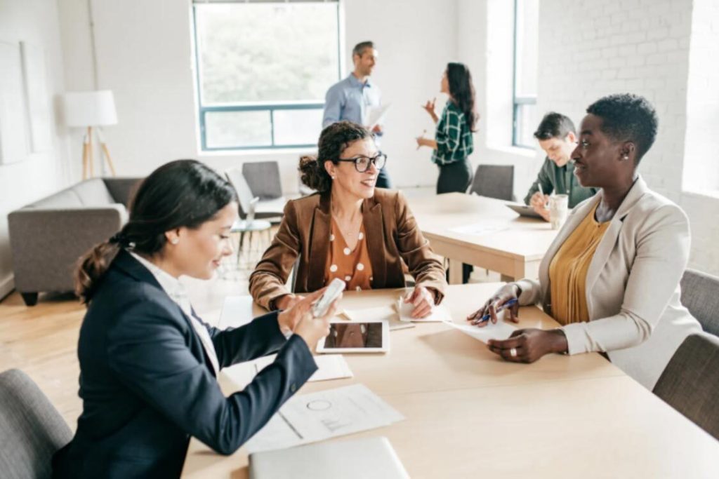 (A corporate team discussing business tax UK strategies and available corporation tax relief during a financial planning meeting.)how much is corporation tax