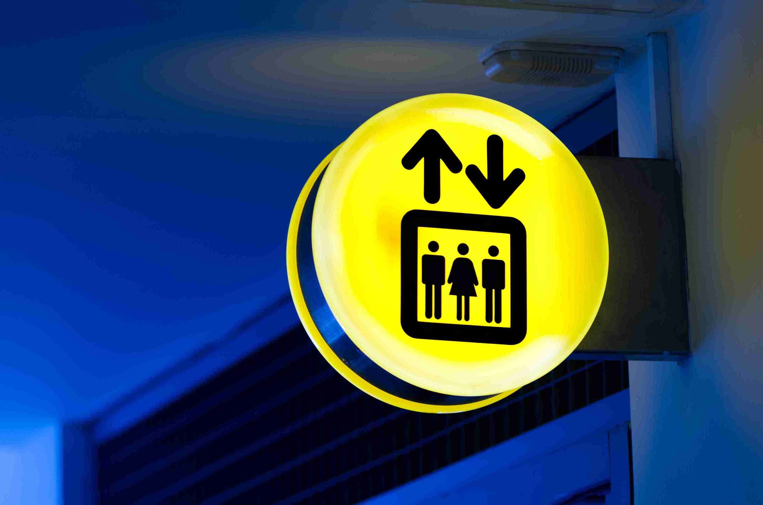 Illuminated projection sign used for lift and wayfinding signage