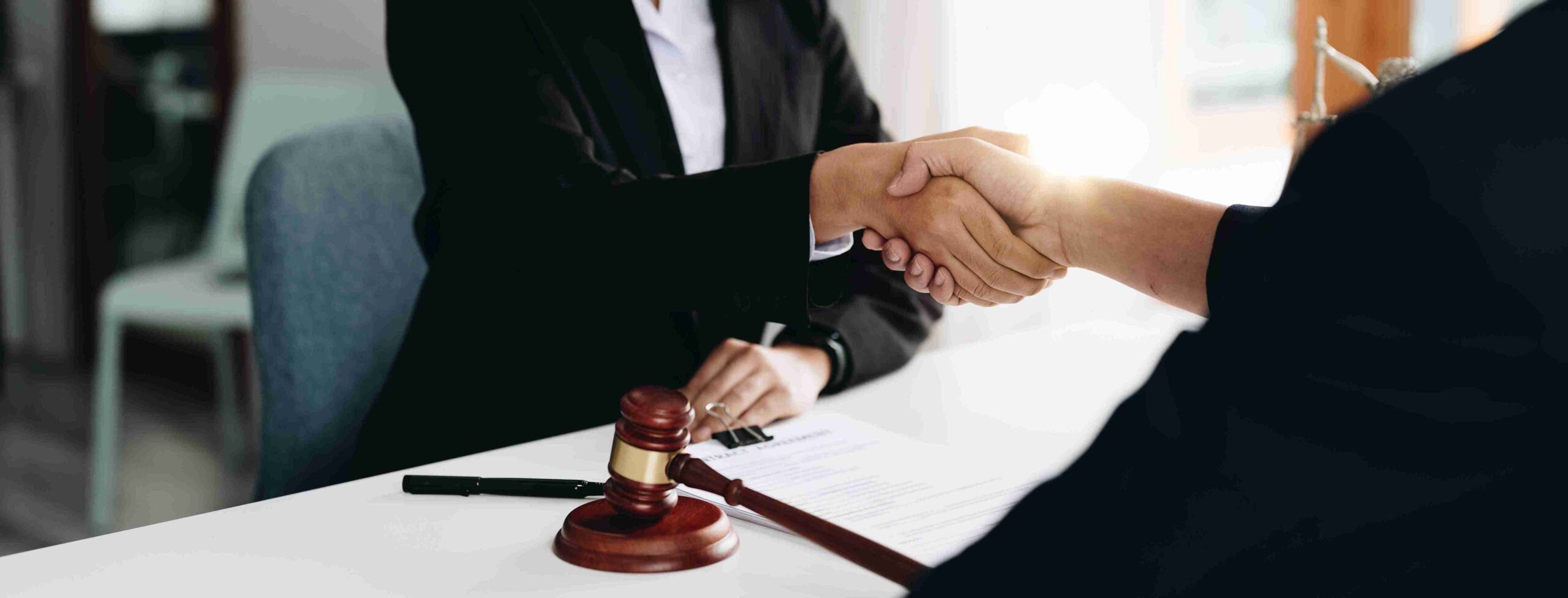 Businessman shaking hands to seal a deal Judges male lawyers Consultation legal services Consulting