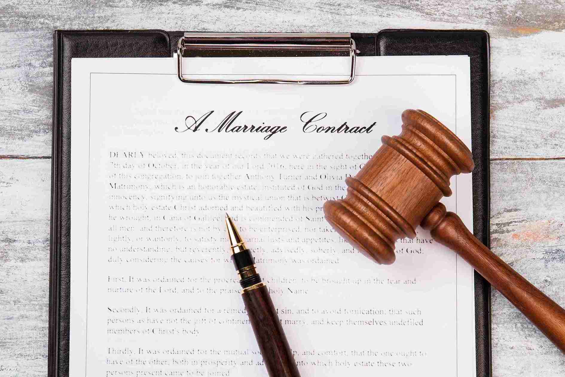 A marriage contract displayed on a clipboard, symbolizing the formal agreement between partners.