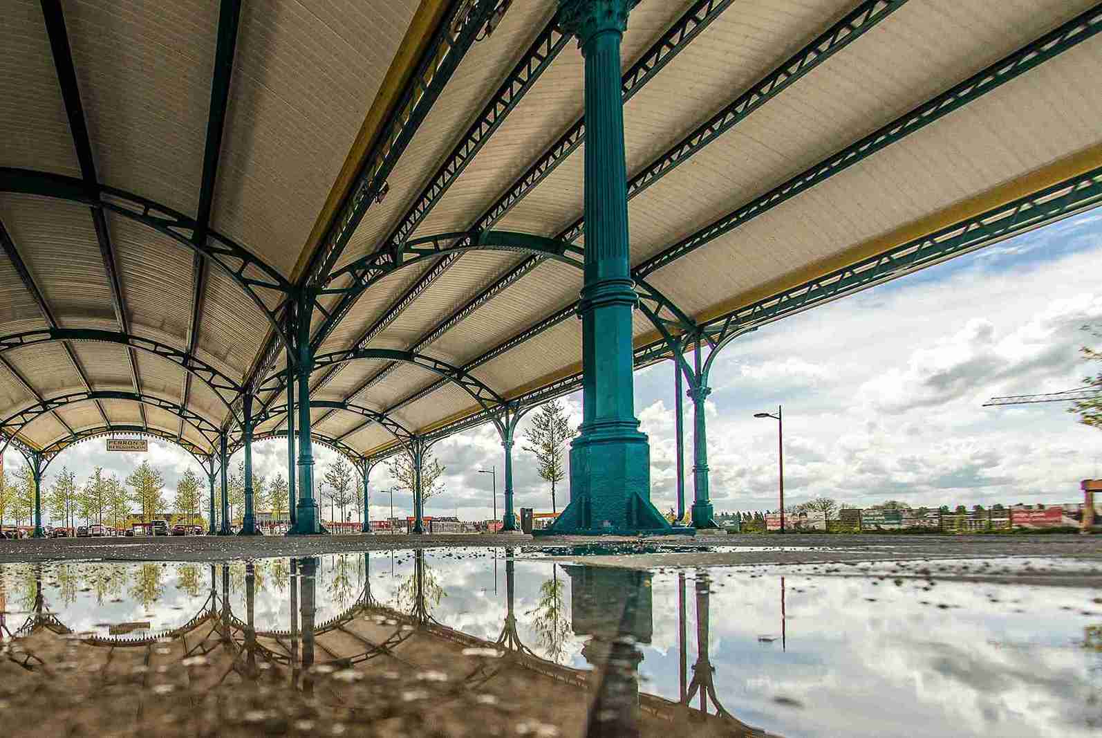 low angle shot of a blue column holding the roof o