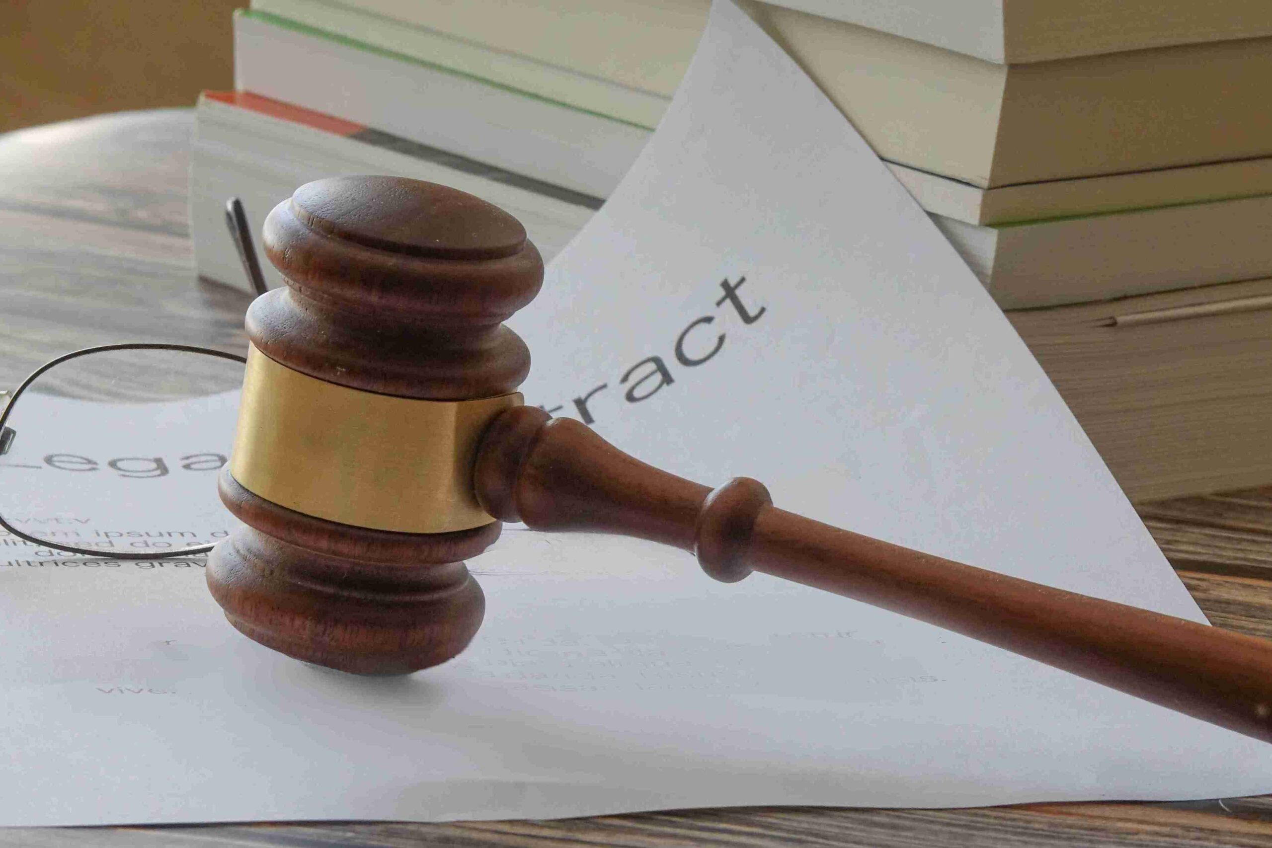 A judge's gavel rests on a legal paper, highlighting the importance of injunctions in legal proceedings.