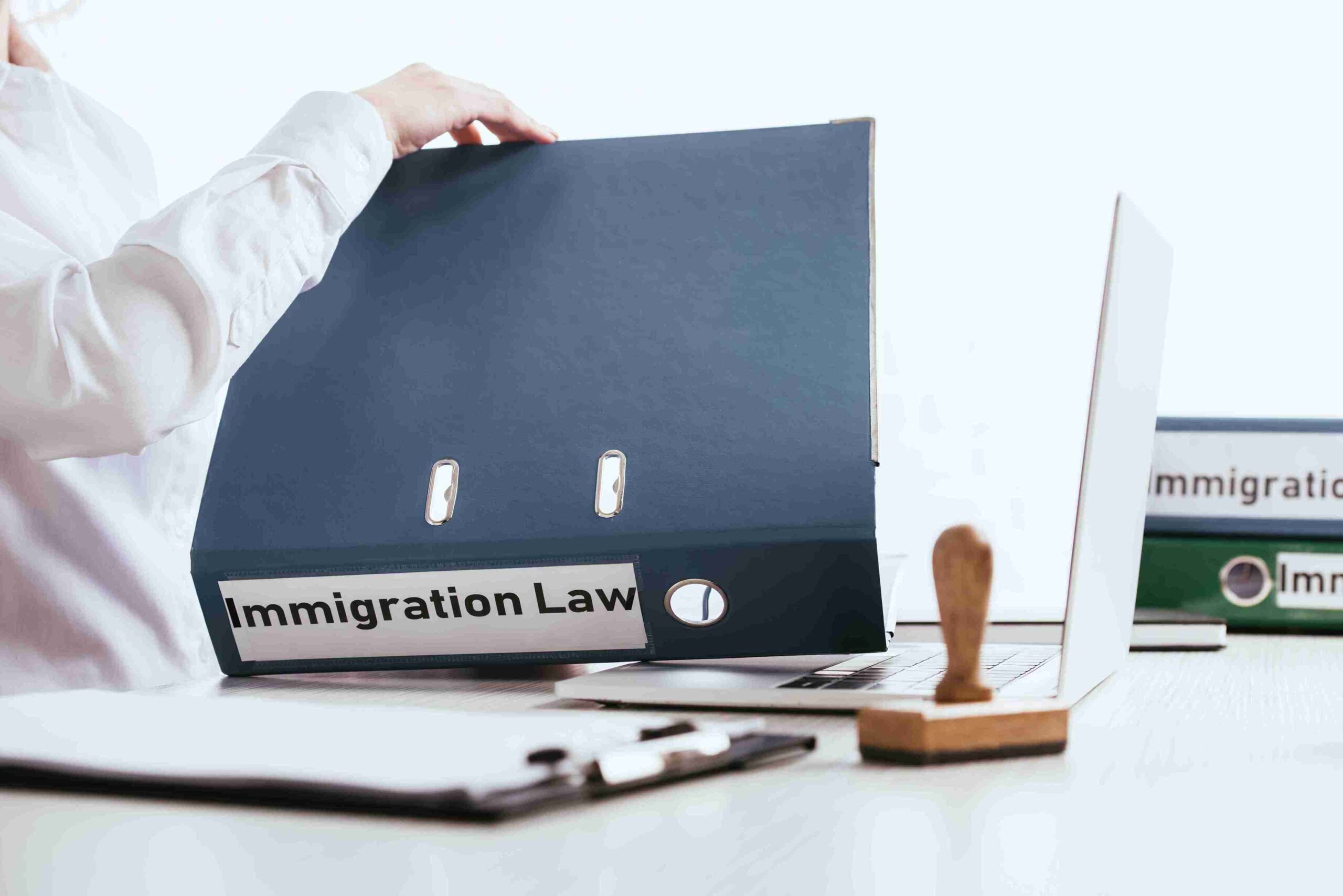 Image depicting the concept of immigration law in UK, featuring legal documents and symbols of immigration.