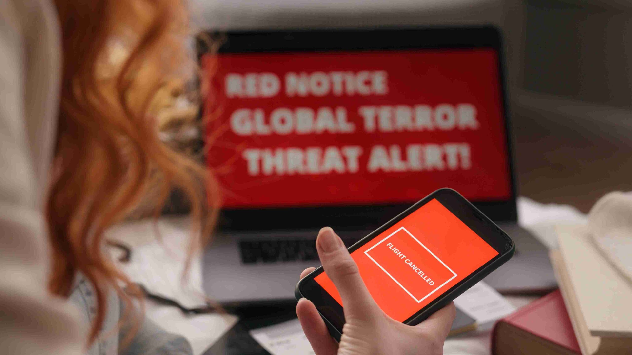 Red notice alert indicating a global terror threat, highlighting urgency and seriousness of the situation.