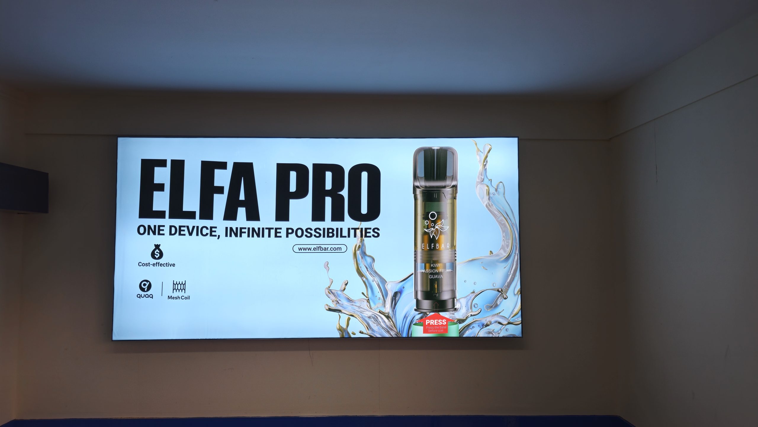 A large screen displays an image of an elfa pro bottle, showcasing its sleek design and branding.