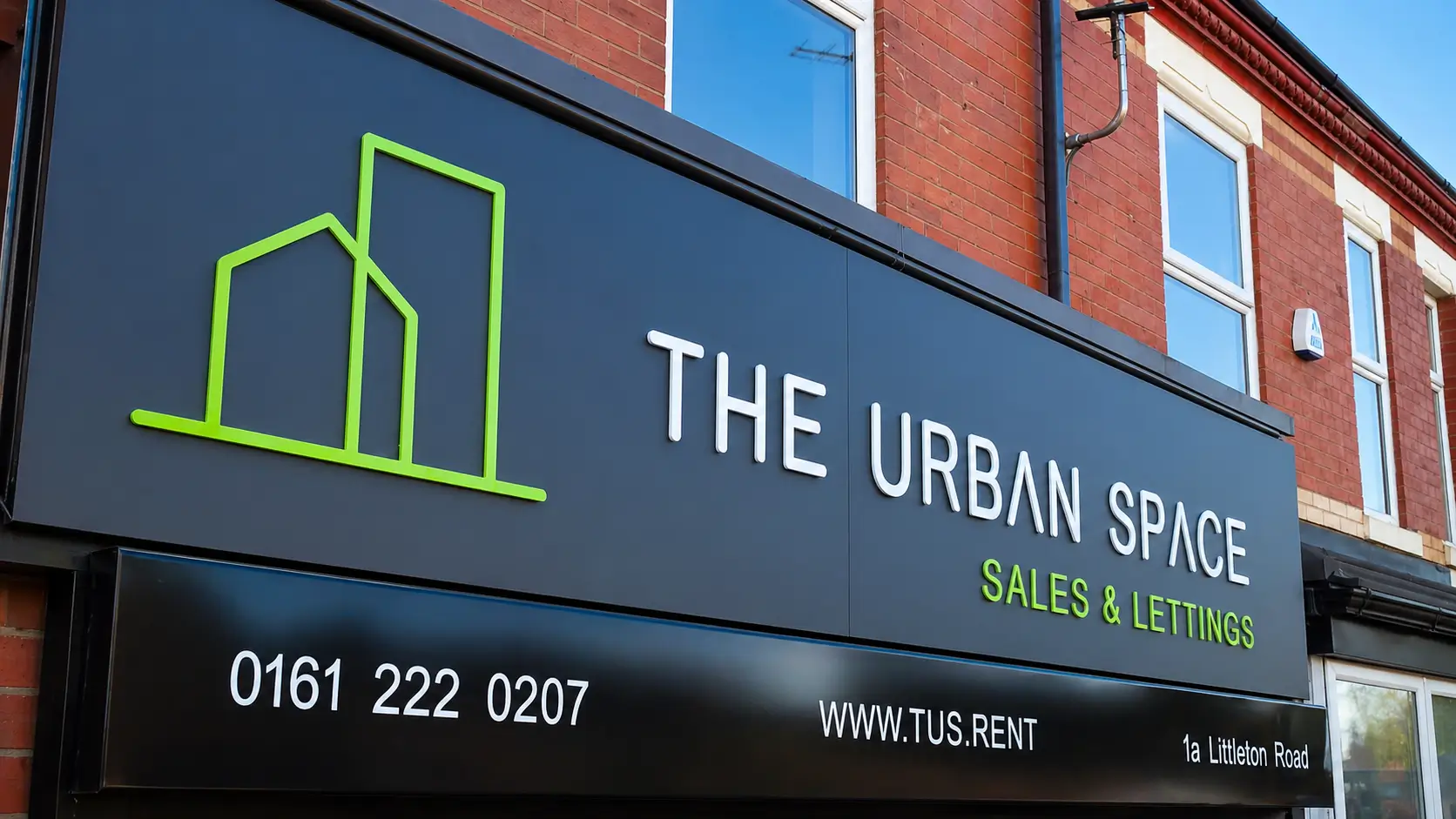 Urban space sales and lettings office showcasing modern properties and vibrant city life in a bustling environment.