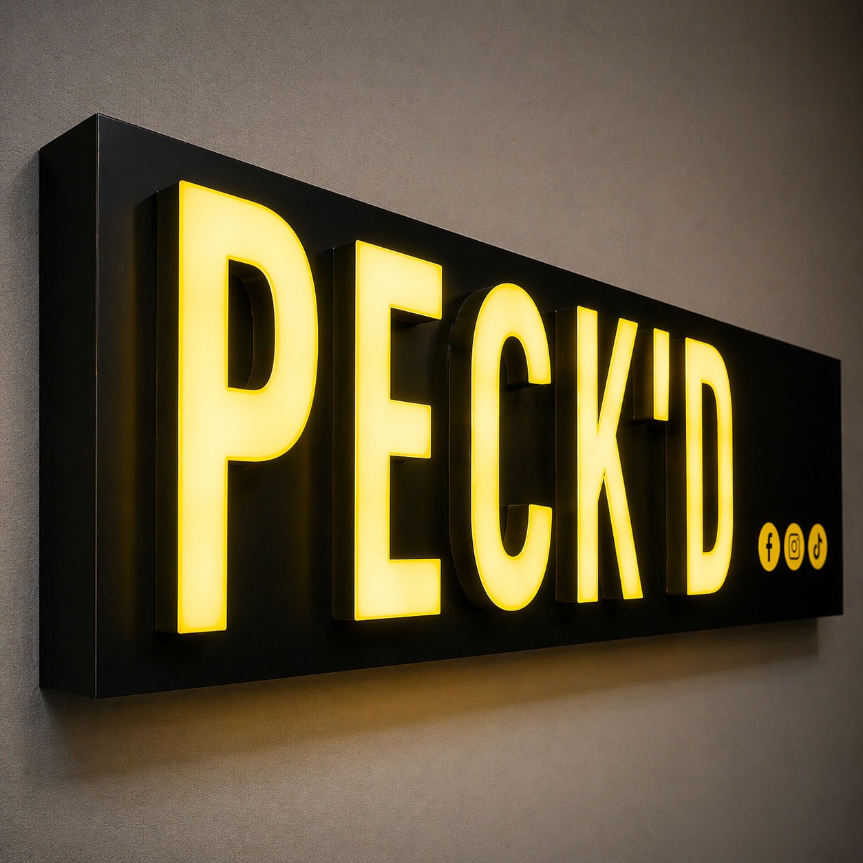A bright yellow sign displaying the text "peck'd d" prominently in the center.