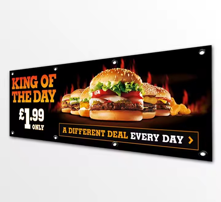 Banner featuring a delicious burger with the text "King of the Day" promoting a special meal deal.