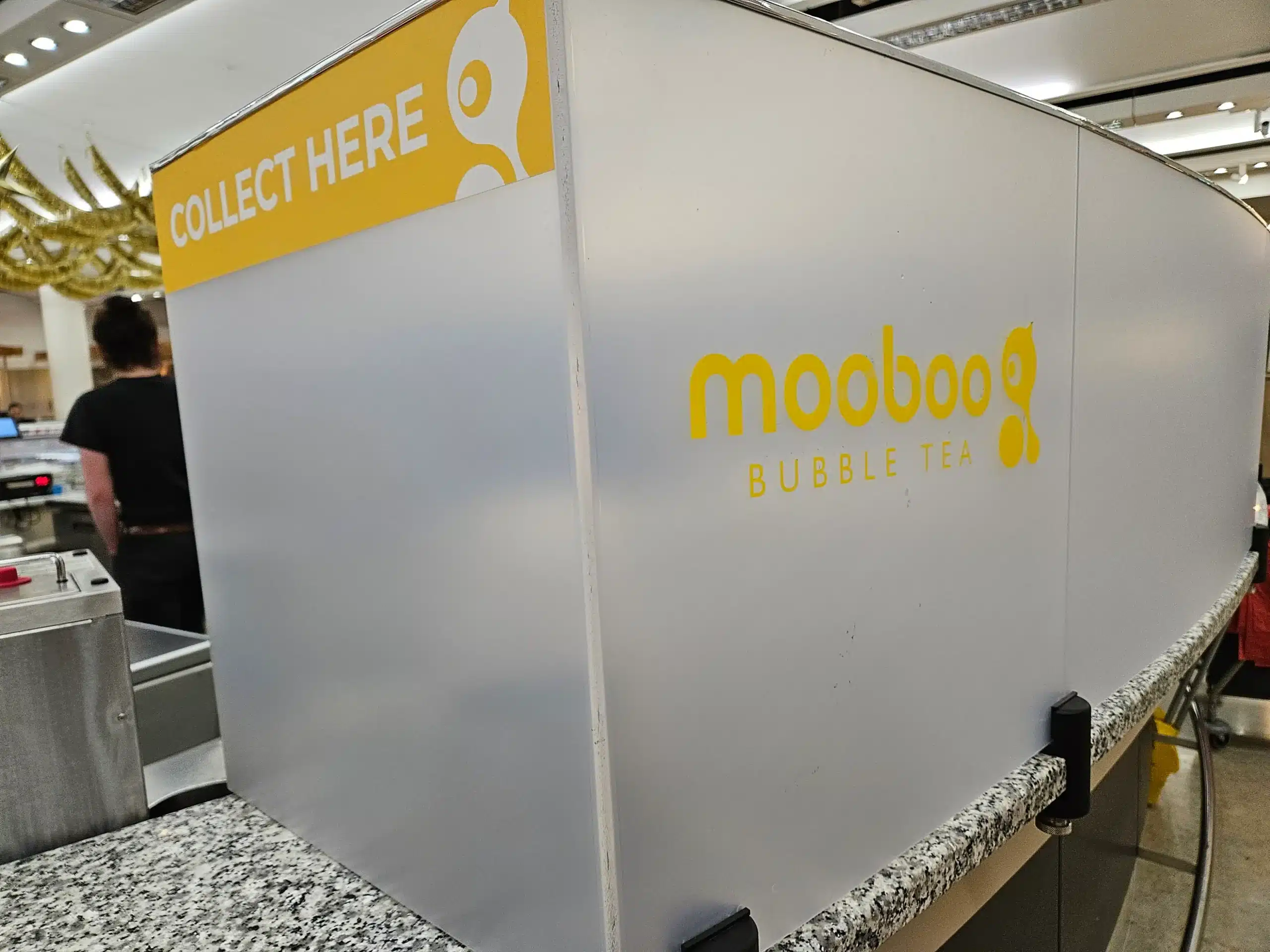 A large white box featuring a sign that reads "moooboo," suggesting a playful or whimsical theme.